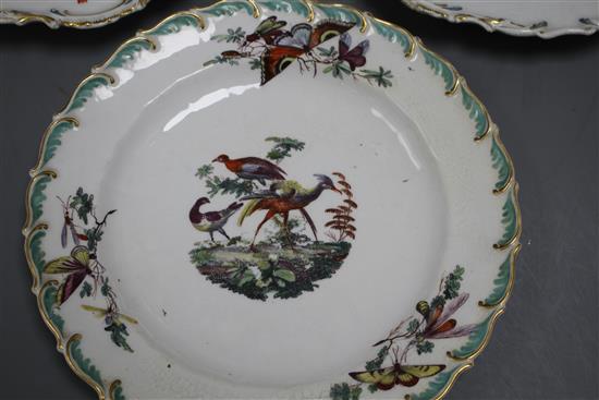 A Chelsea gold anchor bird and insect plate and a similar pair of floral plates, c. 1765, 22 and 23cm